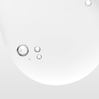 Close-up of water droplets on a white surface