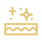 Gold icon of a cake with a crown on a white background