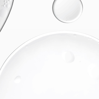 Close-up of a clear glass plate on a white background