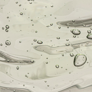 Close-up of water surface with bubbles and ripples