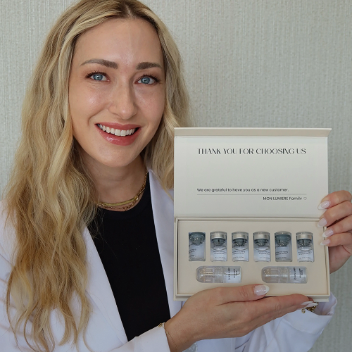 Woman holding a skincare product set