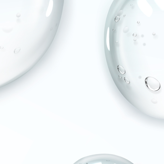 Close-up of clear gel with bubbles on a white background
